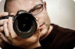 Professional Photography for your Silicon Valley home Man holding camera up to his face, looking through viewfinder