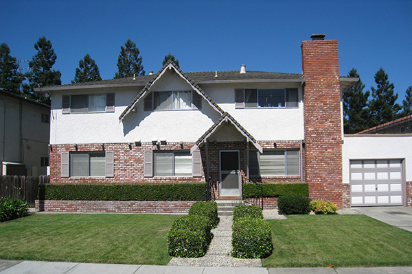 Beautiful white and brick fourplex