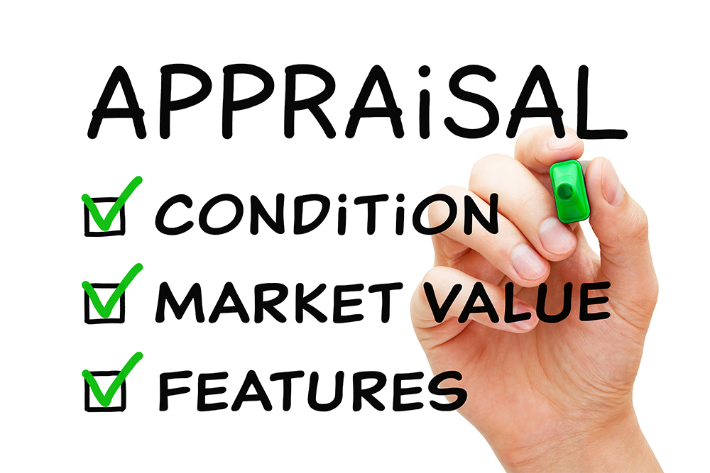 Home appraisals in Campbell CA Hand holding a green highlighter and checking boxes