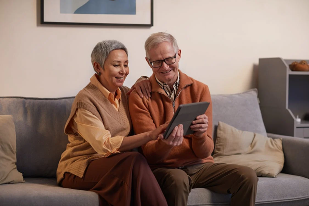 Moving Elderly Couple Sitting Together by Pexels