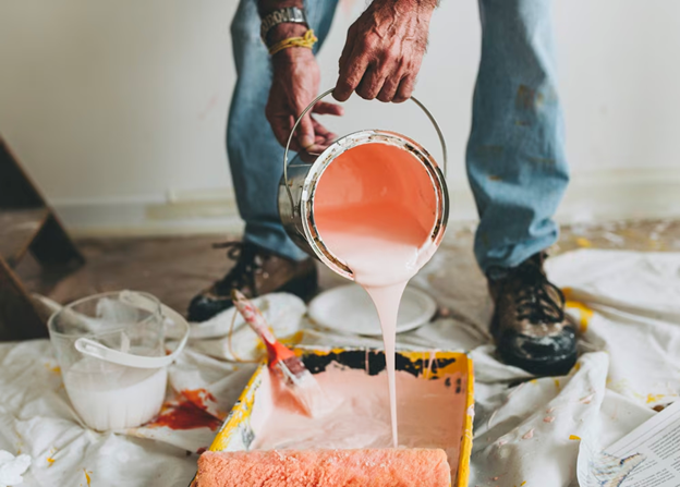 Pouring Paint to Freshly Paint a Room