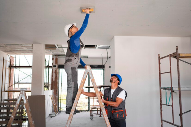 Workers fixing property